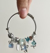 تصویر دستبند تیتانیوم طرح آویز گل پروانه 