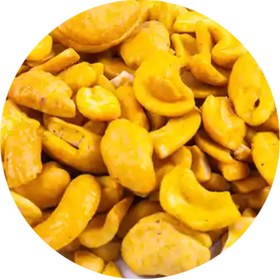 تصویر بادام‌ هندی زعفرانی پرک و خرد 