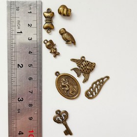 تصویر 10 گرم خرجکار زردقلم کلید، جغد، اسکلت، ماهی و... (وسایل ساخت زیورالات) 