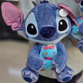 تصویر عروسک استیچ بچه بدست 