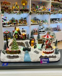 تصویر دهکده برفی موزیکال کریسمس،کاروسل و درخت کریسمس 