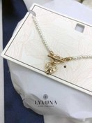 تصویر پابند مرواریدی با قلب طلایی و مروارید 