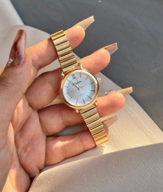 تصویر ساعت کوشی طلایی و آیتم های ست 