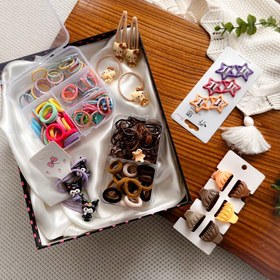 تصویر کش و‌ گیره مو رنگی و پیکسلی 