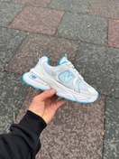 تصویر کتانی دخترانه نیو بالانس مدل 9060 با رویه چرم 