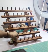 تصویر استند نخ خیاطی مدل پله ای آقای نجار 