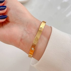 تصویر دستبند کارتیر طلایی 