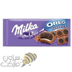 تصویر شکلات تخته‌ای میلکا با بیسکوئیت ساندویچی اورئو و کرم وانیلی _ ۱۰۰ گرم Milka oreo sandwich