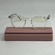 تصویر عینگ گرد بی رنگ با عدسی بلوکات 