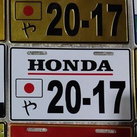 تصویر پلاک موتورسیکلت پاکشتی هوندا لوگو برجسته honda در دو رنگ طلایی و سفید پلاک موتور سیکلت پا کشتی گرینو دیو جوکر اسکوپی 