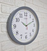 تصویر ساعت دیواری سیتی زن مدل ساده سایز ۳۱ سانت شب نما طوسی 