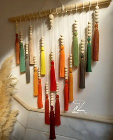 تصویر رنگین کمان نخ و مهره 