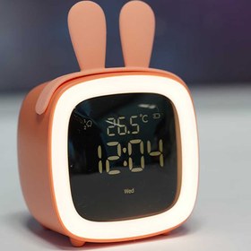 تصویر ساعت رومیزی به همراه چراغ خواب مدل Cute Pet TV Night-light Alarm Clock 