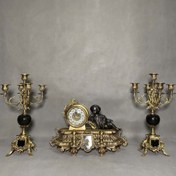 تصویر ساعت و شمعدان آنتیک با سنگ مشکی پسرک خوابیده برنز 