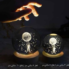 تصویر چراغ خواب گوی کریستال طرح فضانورد و ماه سایز ۱ 