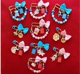 تصویر سنجاق آویز لباس چشم و نظر نوزاد 