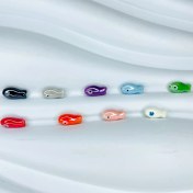 تصویر مهره تزیینی بین کاری طرح ماهی فانتزی 