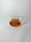 تصویر لیوان خمره‌ای دسته بیضی پیرکس 