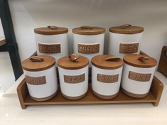 تصویر ست جا ادویه ای سرامیکی 7 تکه | درب چوب گردو طبیعی - ترکیب سنتی و مدرن - سفید 7-piece ceramic spice jar set | Natural walnut wood lid - traditional and modern combination