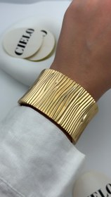 تصویر بنگل پهن خط خطی طلایی 