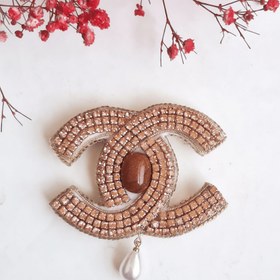 تصویر گل سینه شنل با سنگ دلربا 