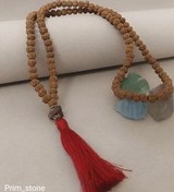 تصویر رودراکشا سایز ۸ همراه با سنگ یاقوت راف و نقره عیار ۹۲۵ 