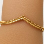 تصویر انگشتر V شکل دانه‌دار طلایی زنانه 